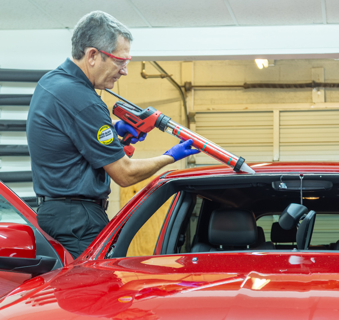 Auto Glass Technician Installing a Windshield